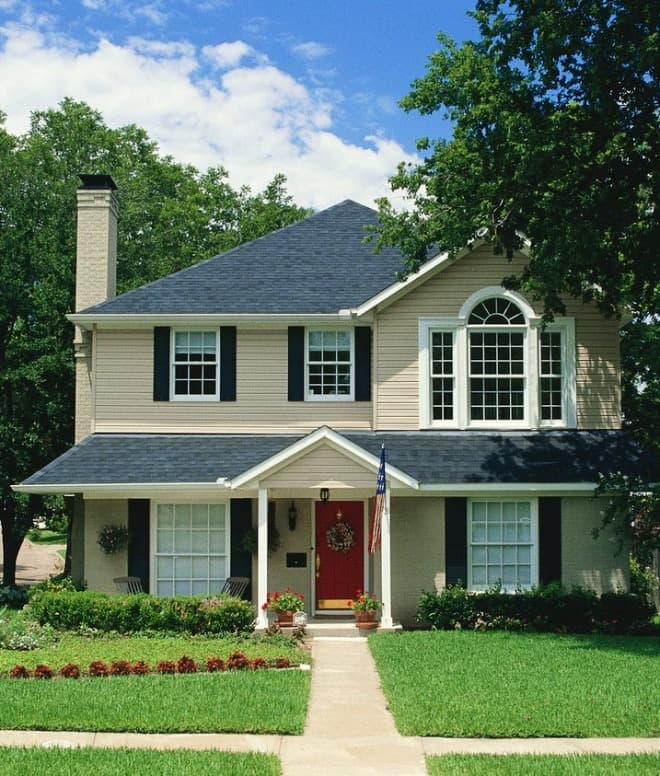 Home with new vinyl siding, gutters, and windows installed by Vinyl and Gutterworks of Shelbyville